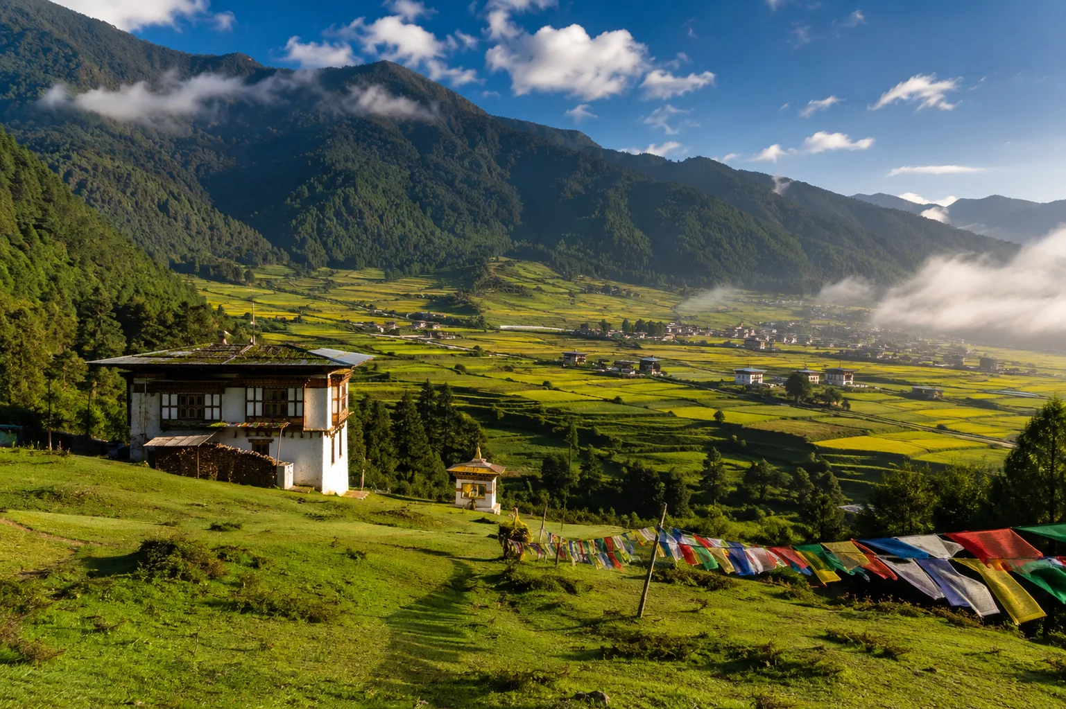 Prayer flags across a mountain valley in Bhutan